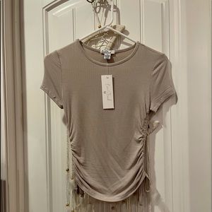 Beige colored tight top